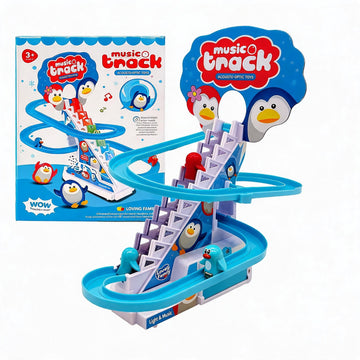 A children's toy set called Music Track by Wow Toys, featuring a blue spiral marble run track with penguin-themed stairs and a matching retail box shown behind it on a white background.