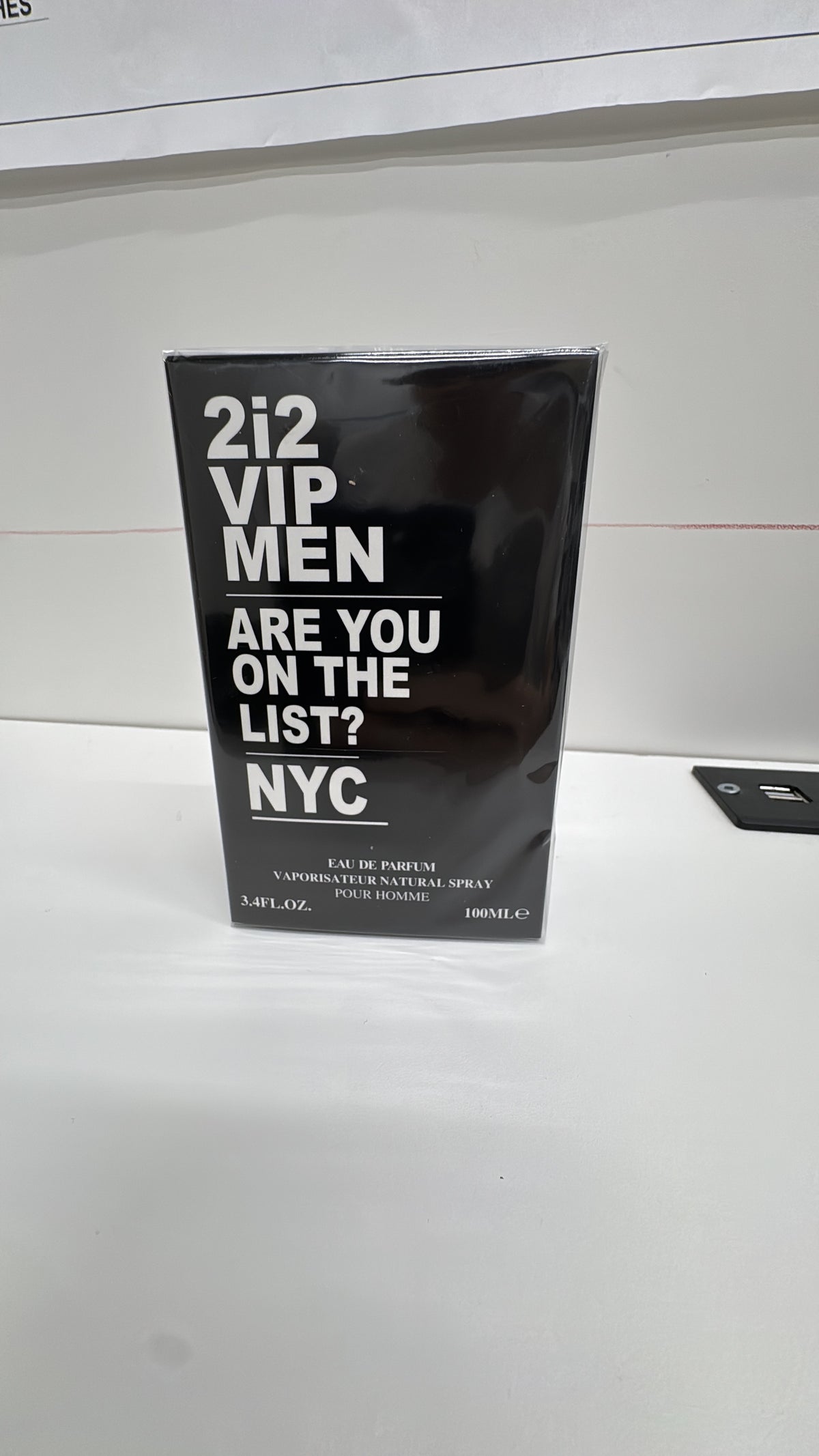 2i2 VIP Men Eau de Parfum black packaging box with white lettering, photographed on a white surface.