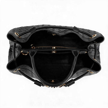 Black woven leather handbag shown from a top-down view, featuring a spacious interior with gold-tone hardware and a zippered compartment.