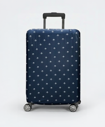 Navy blue suitcase with white airplane pattern on a light gray background