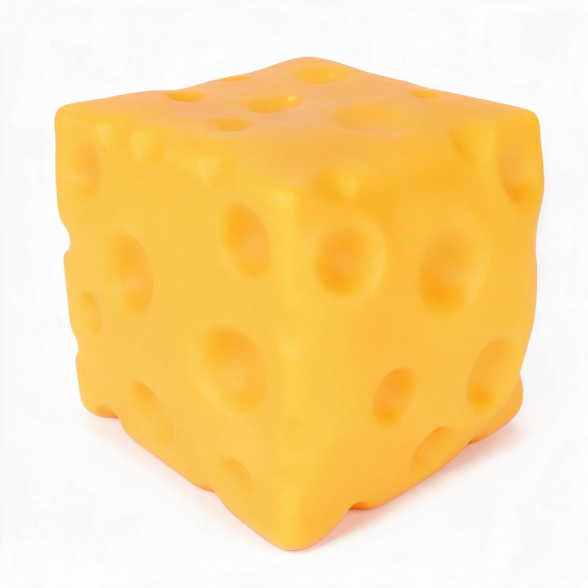 A yellow-orange cheese-shaped cube with realistic holes, photographed on a clean white background.