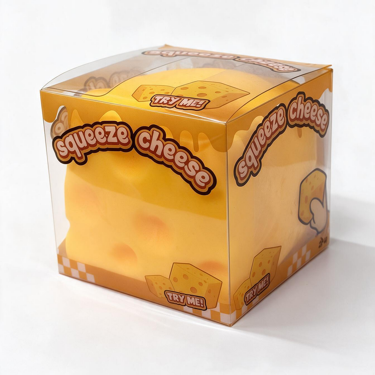 A yellow cheese-shaped squishy toy inside a clear plastic cube box with orange and white graphics and the text 'squeeze cheese' and 'TRY ME!'.