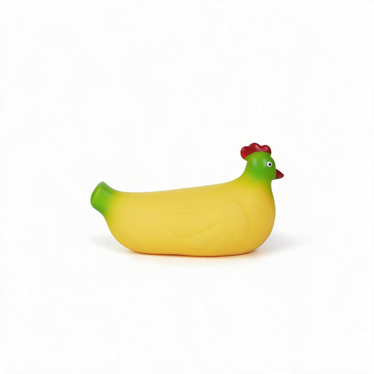 A novelty rubber chicken-shaped bath toy in yellow with green legs and tail, and a red comb, shown on a plain white background.