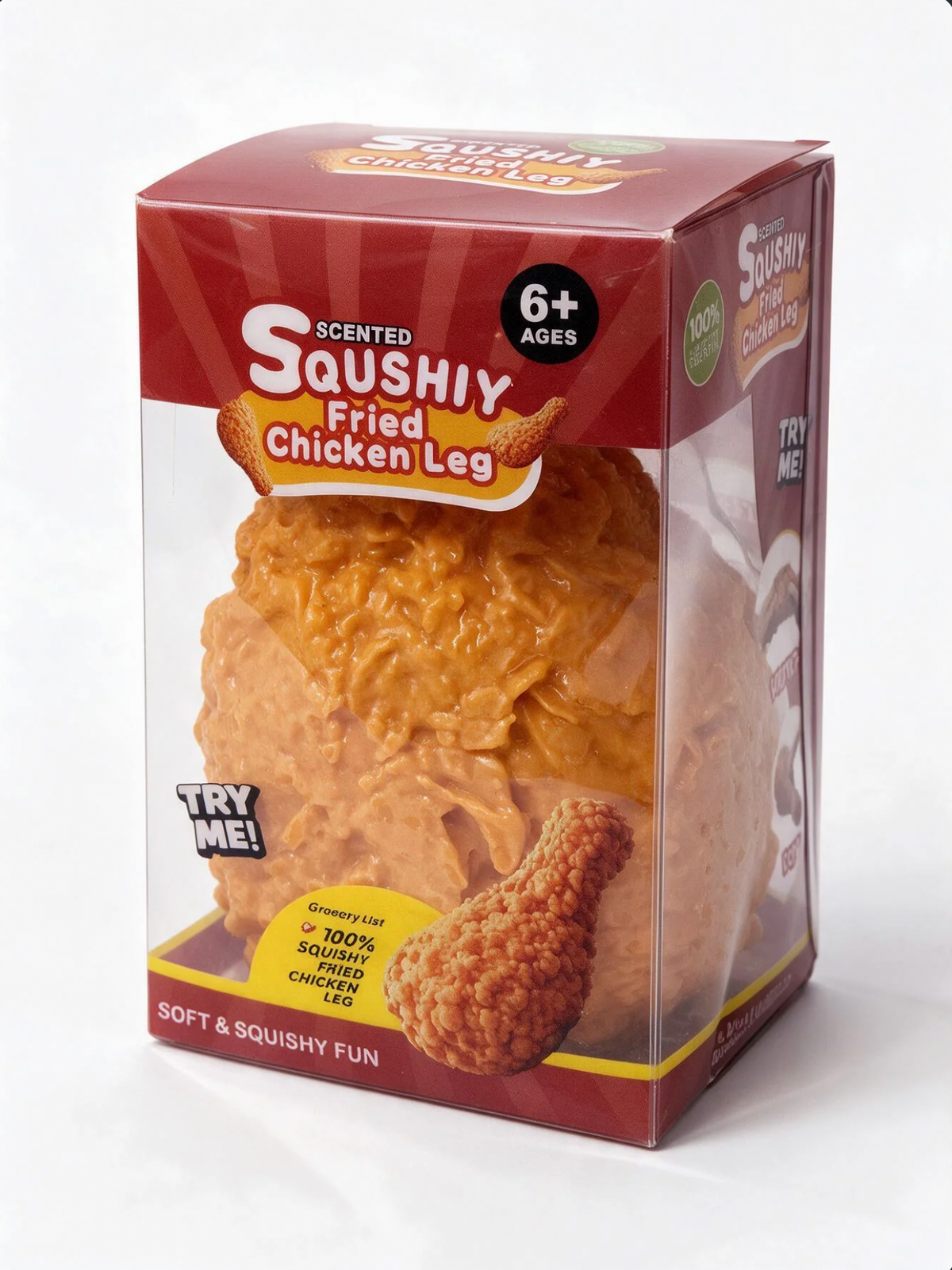 A packaged novelty toy shaped like a fried chicken leg in a clear plastic box with a red cardboard sleeve. The front label reads 'Scented Squishy Fried Chicken Leg' and shows a textured orange-brown squishy leg inside, with a 'TRY ME!' callout and age 6+ graphic.