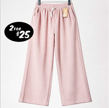 Pink pants with a price tag and promotional text on a white background